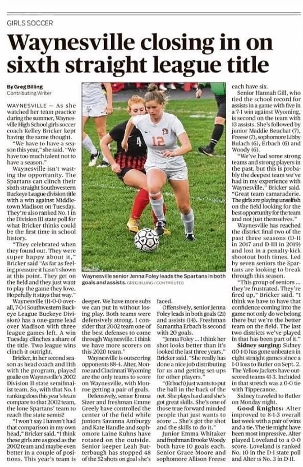 newspaper article with girls soccer players on it